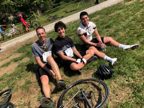 Dr. Simon Warren taking a break during a cycling race with his sons Vincent and John.